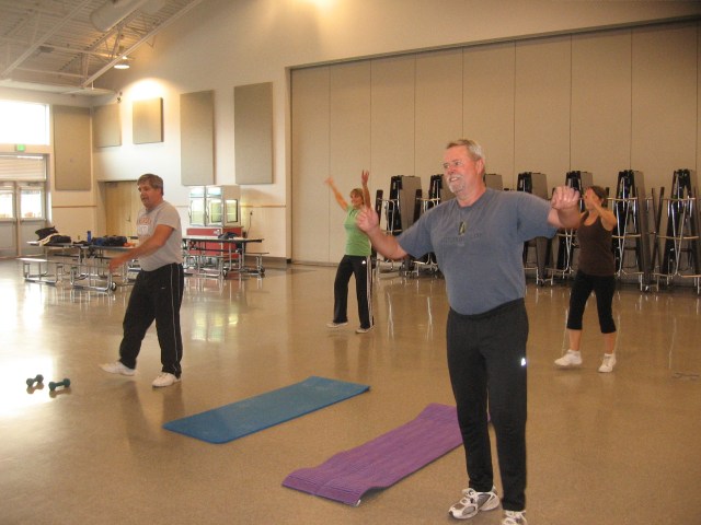 Marty Miller, (r), and Kevin Miller, (l), jazzercising in Graham.