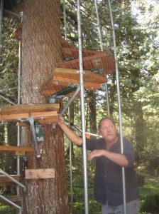 Cedar Creek treehouse, Bill stnading next to the spiral staircase, IMG_1255