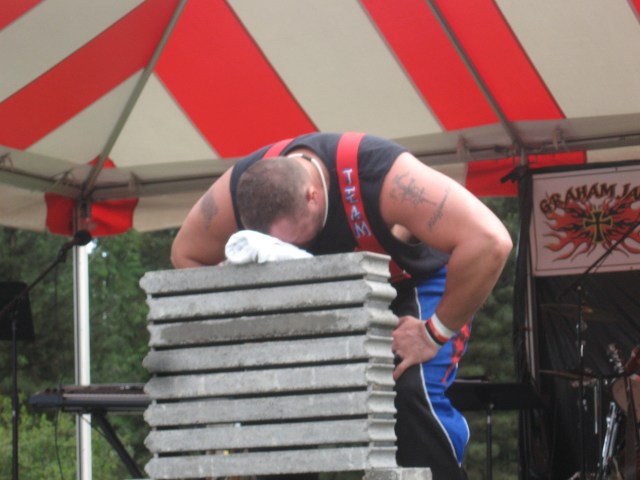 Power Team strongman - and former Atlanta Falcon footballer - Matt Dobson prepares to "smash some stuff" with his forehead.